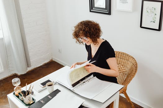 Smiling woman doing her paperwork 