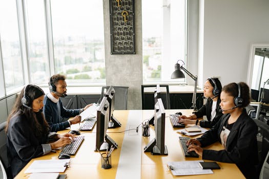 Photo of busy working call center agents