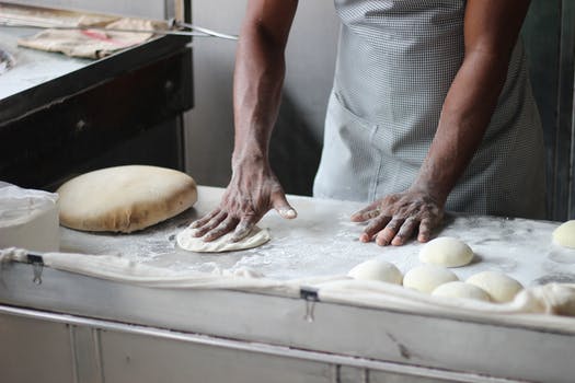 Man preparing dough for bread