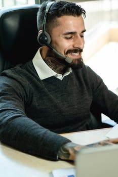 Cheerful man working in a call center