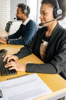 Man and woman sitting on the table working