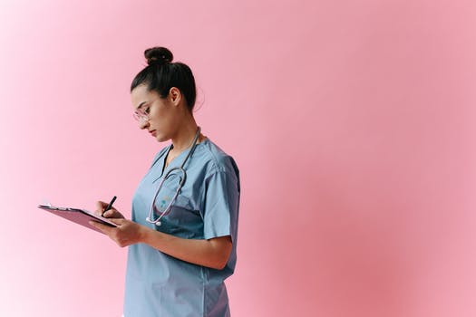 Woman in white button up shirt holding black smartphone