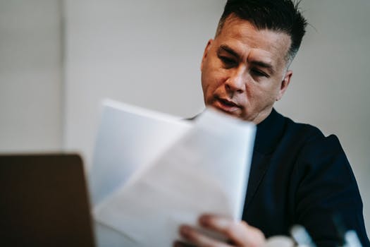 Photo of man reviewing the documents