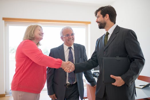 Man and woman shaking hands