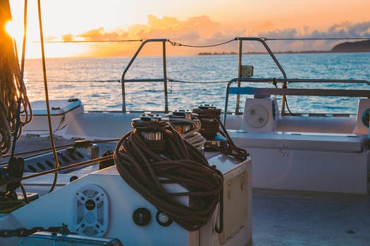 White deck of boat in middle of sea