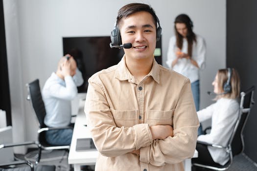 Smiling man in brown long sleeve shirt wearing headphones