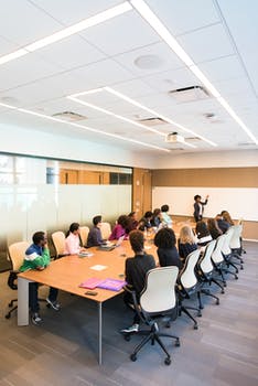 People having meeting inside conference room