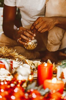 A person preparing christmas decors