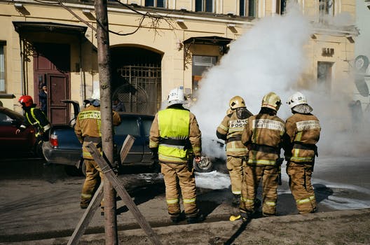 Group of firefighters near building