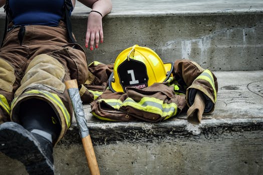 Yellow hard hat on brown and yellow fireman s suit