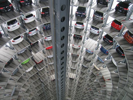 Vehicles parked inside elevated parking lot 