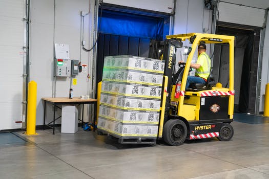 Man riding on yellow forklift