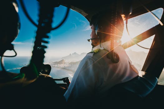 Man flying helicopter