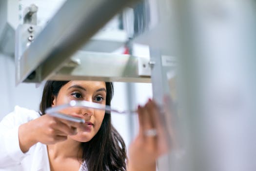 Photo of female engineer working on an equipment