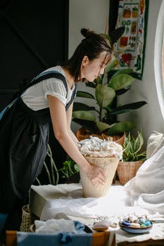 Young asian woman with basket in light room