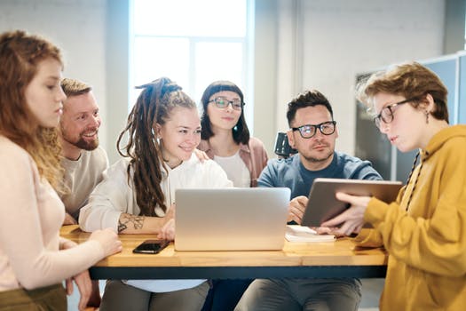 Photo of people looking on tablet