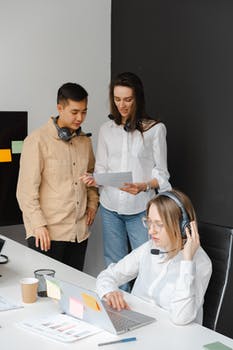 Man and women working in a call center office