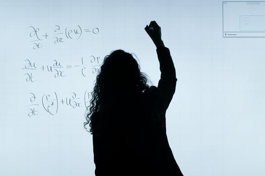 Woman writing on a whiteboard