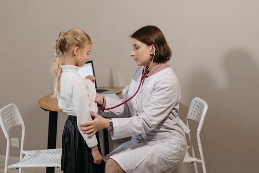 A doctor examining a child patient 