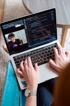 Person using gray laptop 