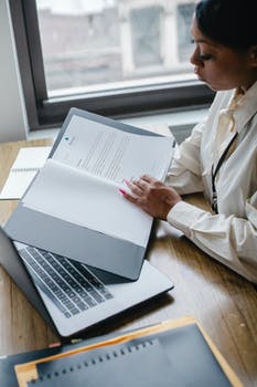 Black woman working with documents in office