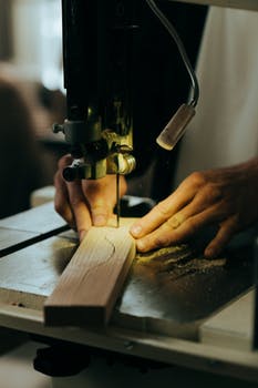 Person holding brown wooden handle