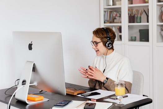 Positive woman having video call on computer