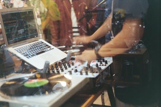 Person using audio mixer controller