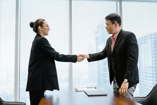 A man and a woman shaking hands